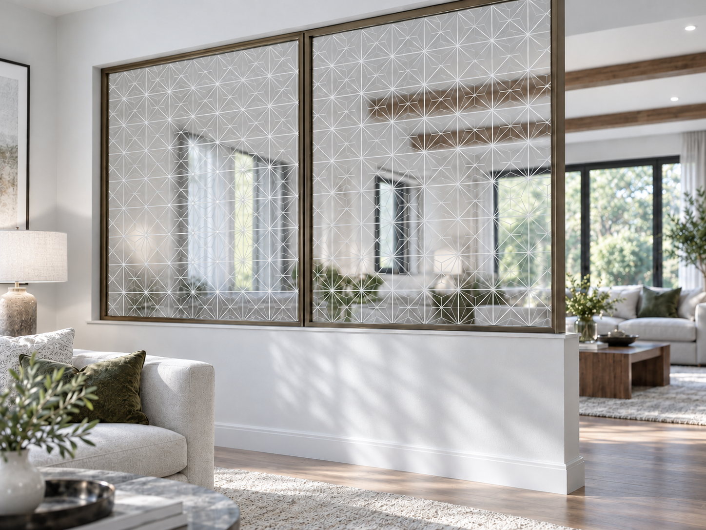 Astra geometric glass partition installed above a dividing half-wall, conceptual scene